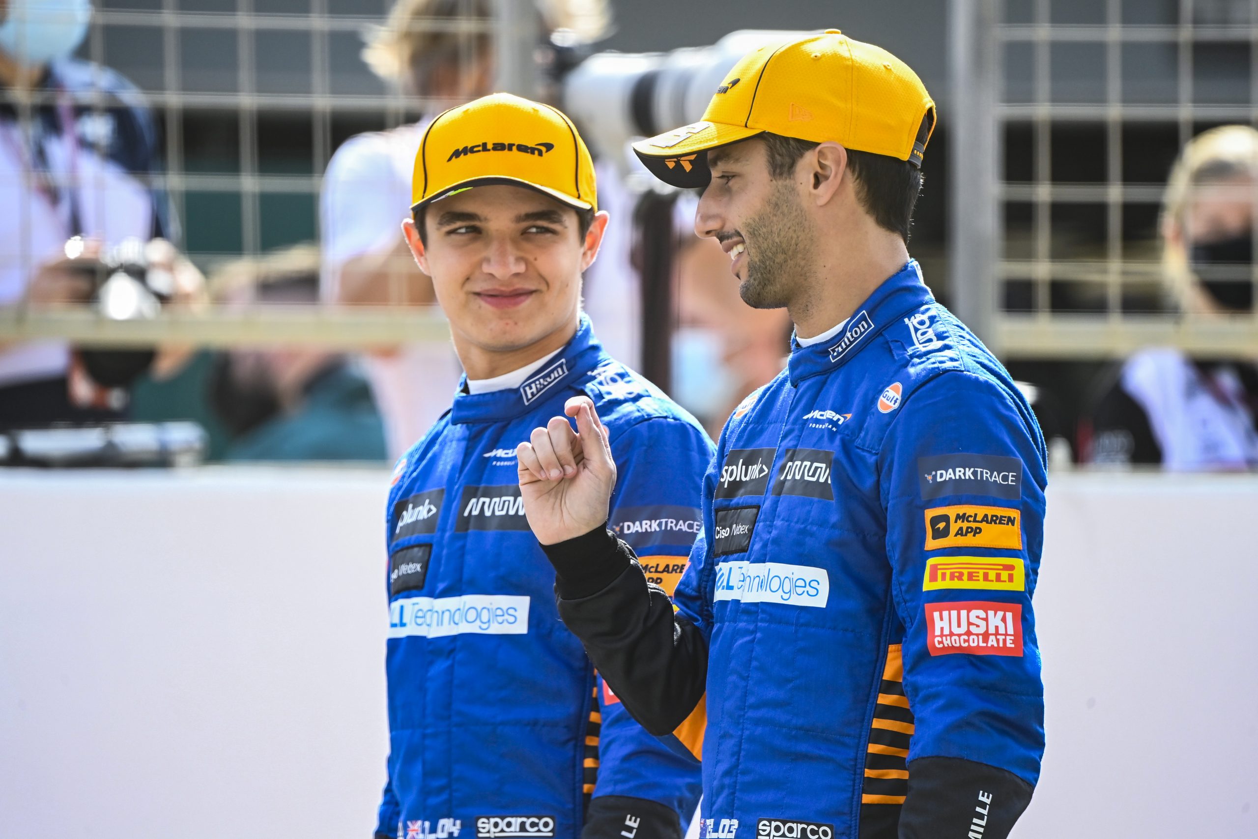 Lando Norris, McLaren, and Daniel Ricciardo, McLaren, pose on the grid